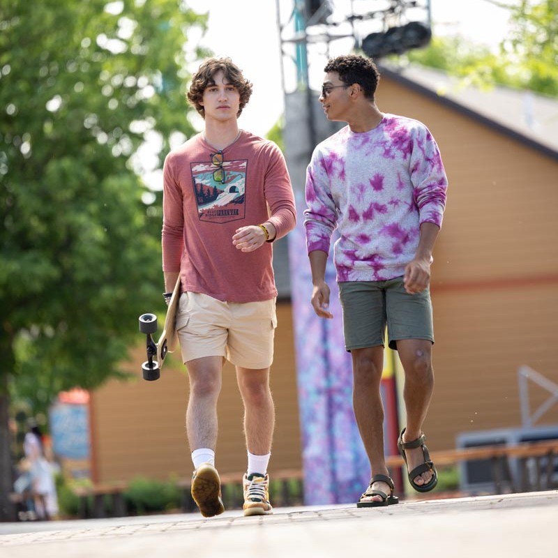 2 boys walking down road